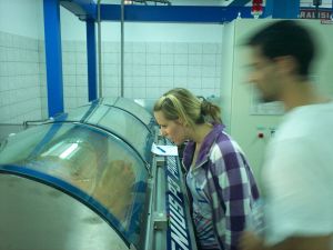 Anita, with husband Jeremy looking on, checks to batch before it goes to the centrifuge 